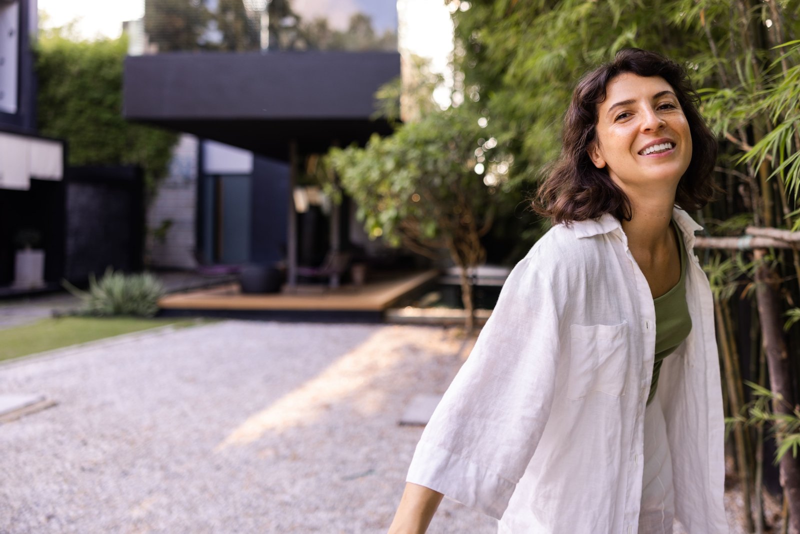 beautiful-woman-outdoors-white-shirt-looking-camera